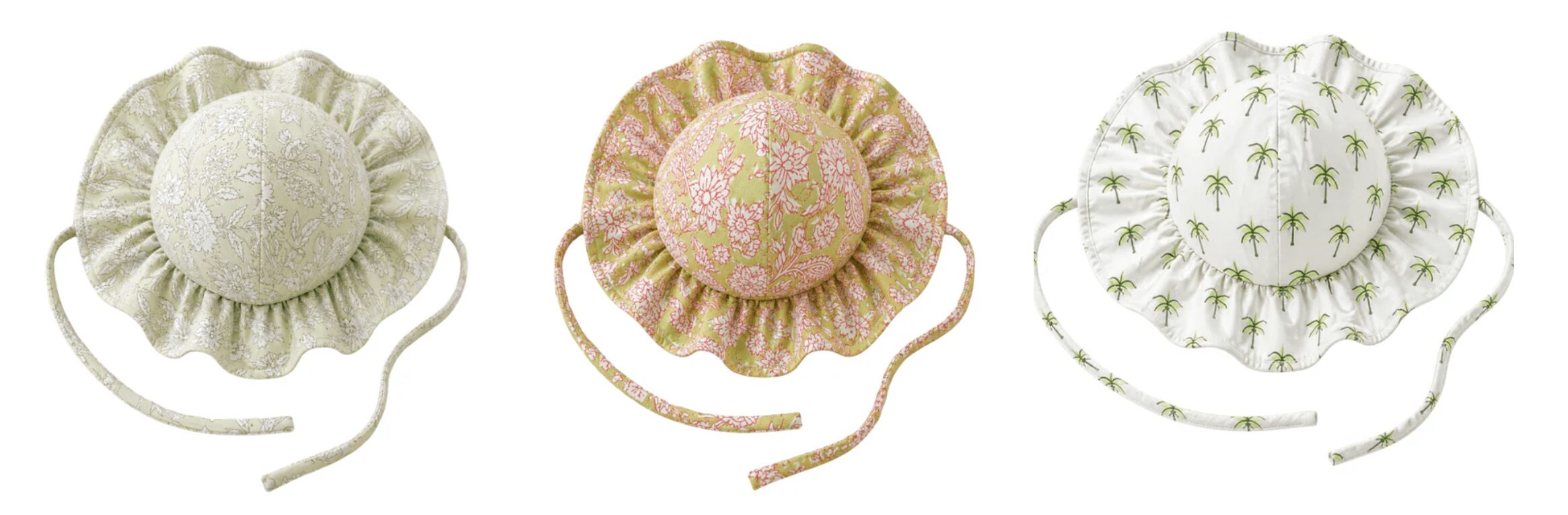 Three round fabric-covered objects with ruffled edges, each with a different pattern and color, on a white background.