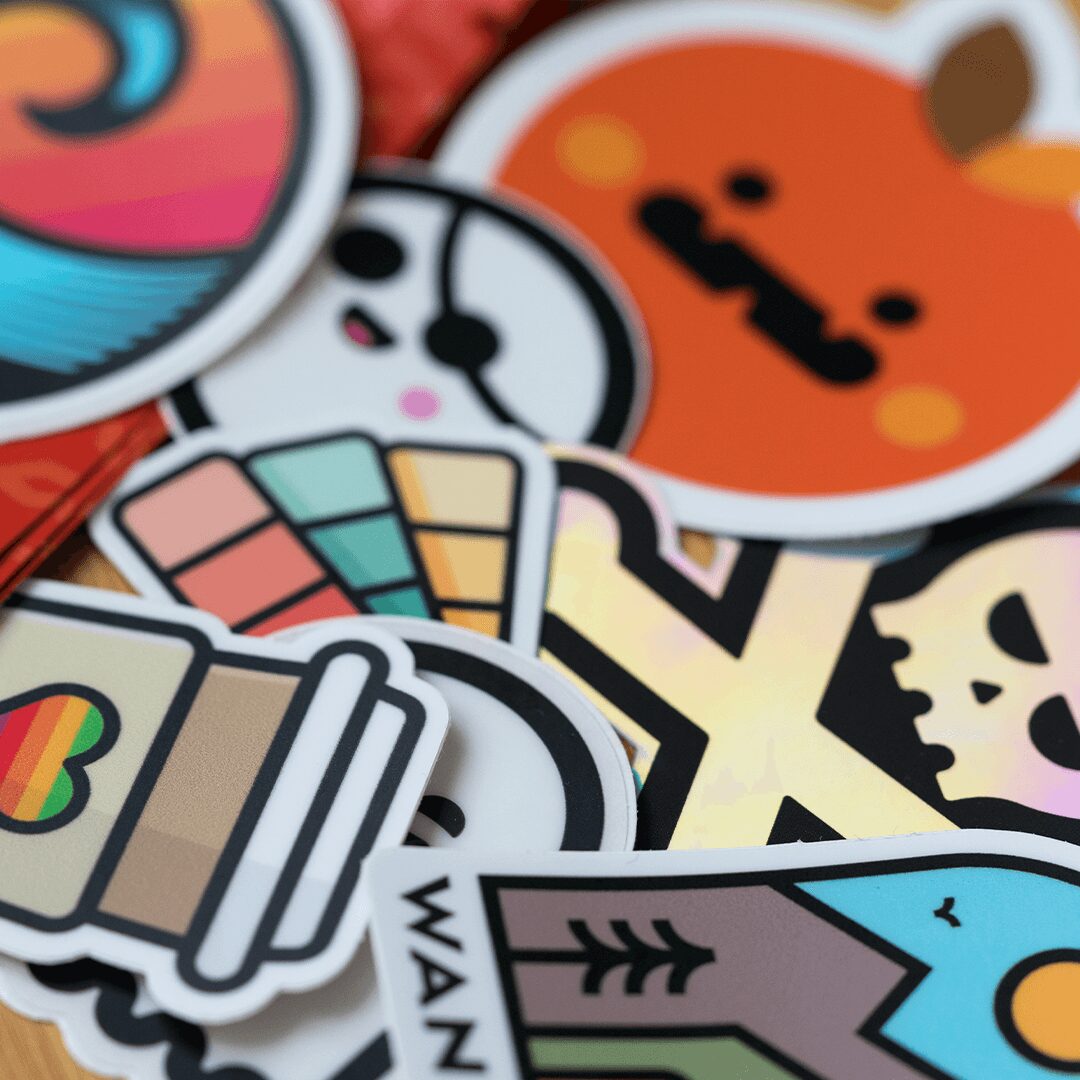 Collection of colorful stickers with various designs including animals, objects, and abstract patterns.
