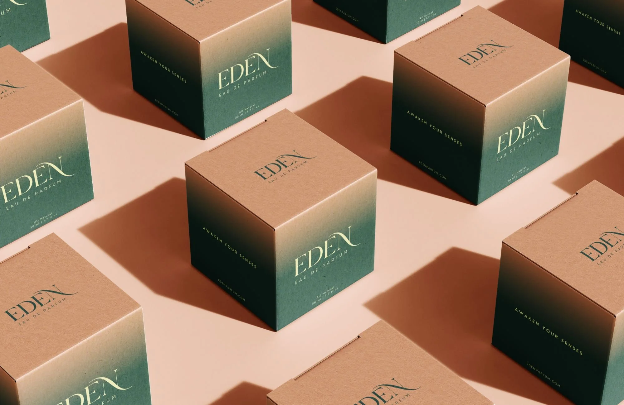 Multiple beige and green boxes labeled 'EDEL' arranged on a surface with shadows.
