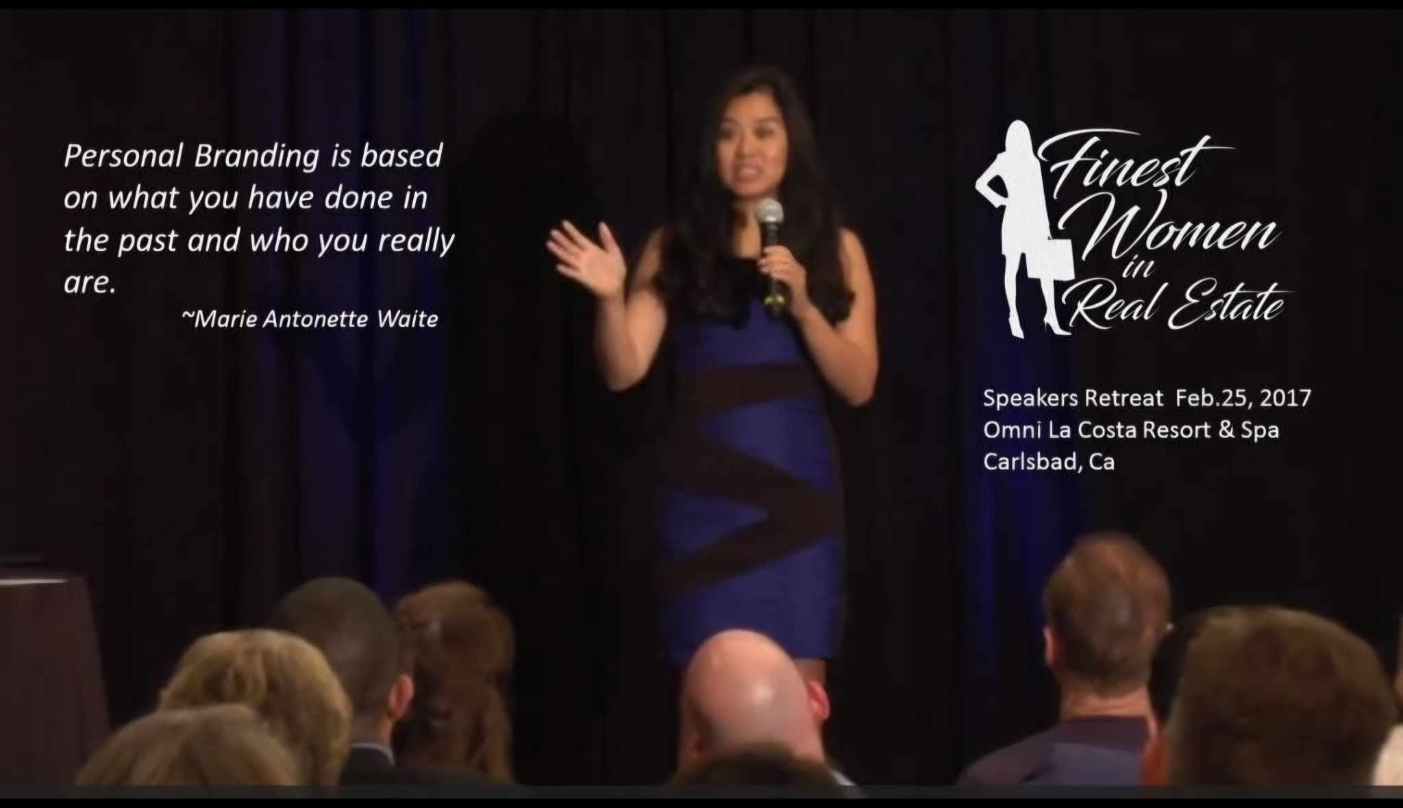 Woman speaking on stage at a conference, audience in foreground, event details on right, logo and text on black background.