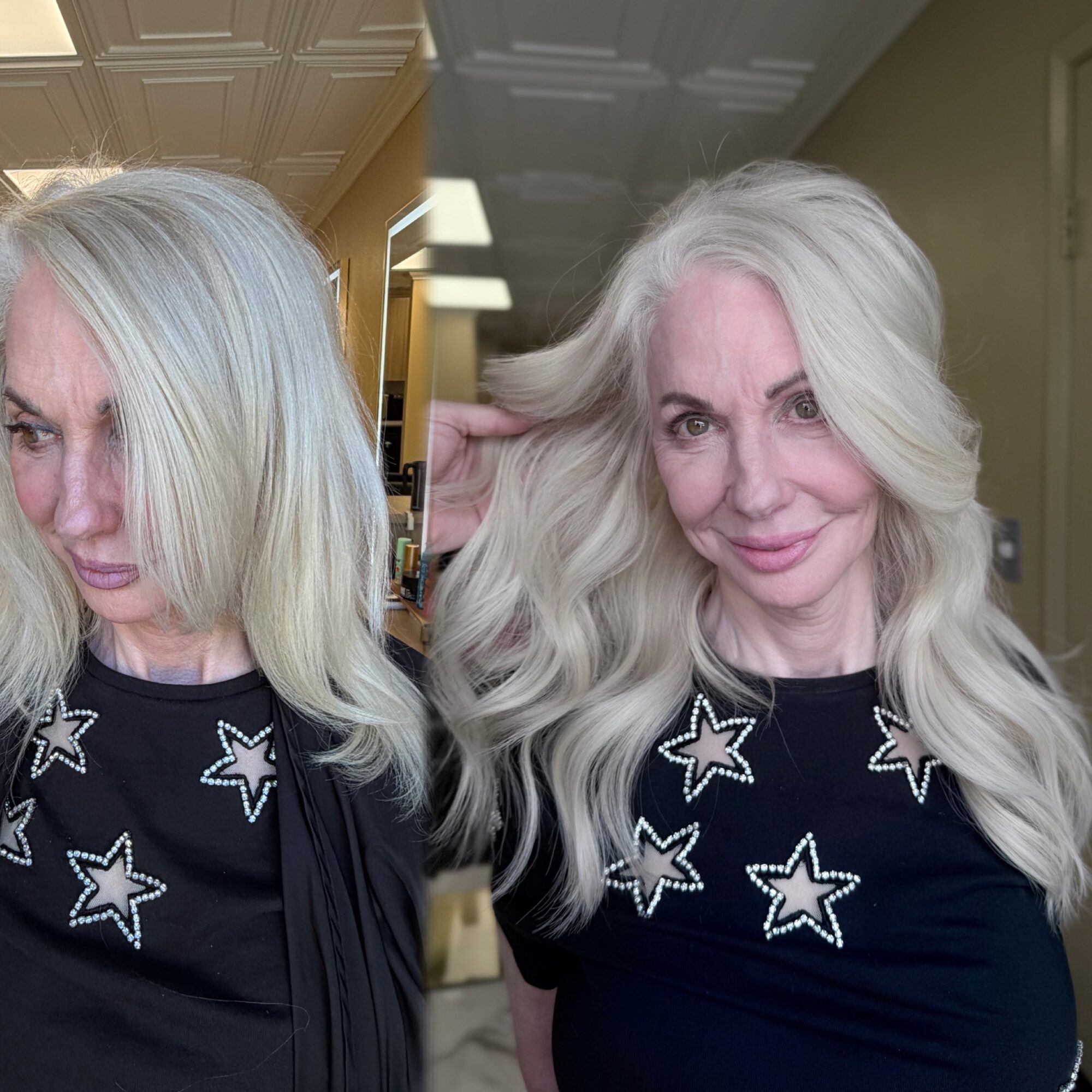 Woman with long, wavy, platinum blonde hair smiling, wearing a black top with star patterns, indoors.
