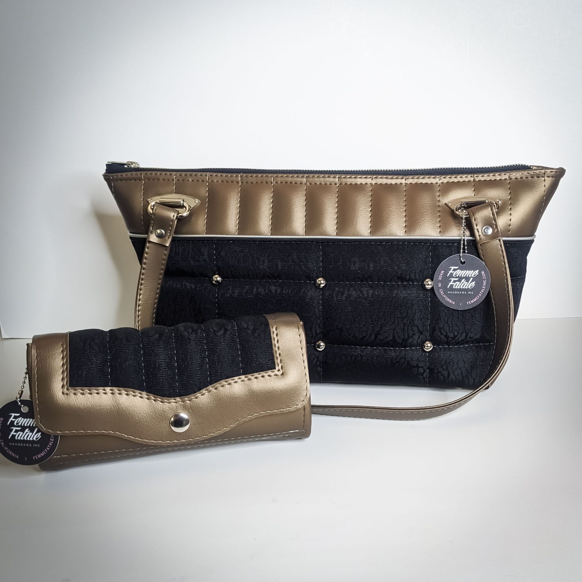A metallic gold and black waist belt with a padded black section, displayed on a white surface.