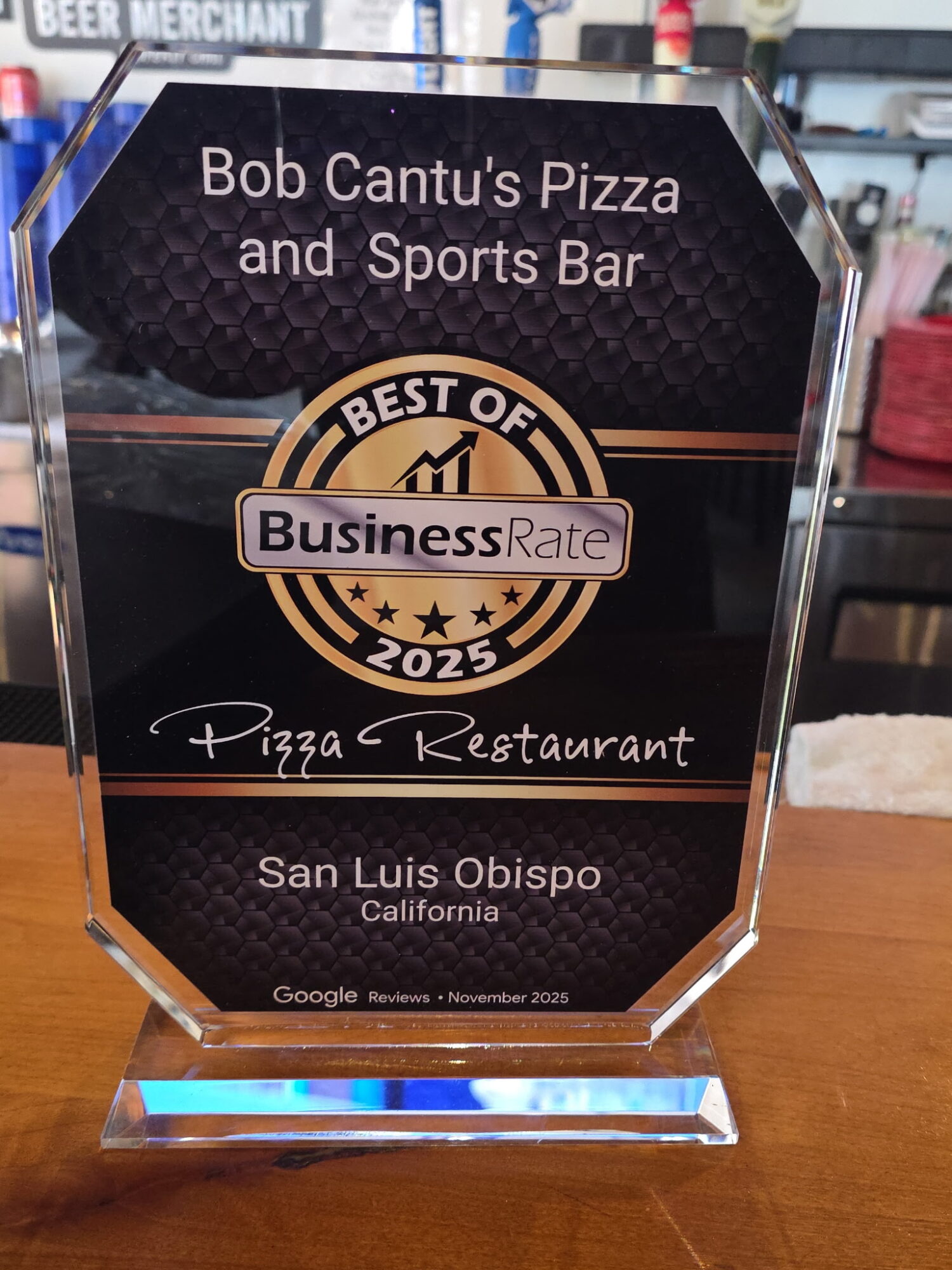 Award plaque for Bob Cantu's Pizza and Sports Bar, Business Rate 2025, located in San Luis Obispo, California.