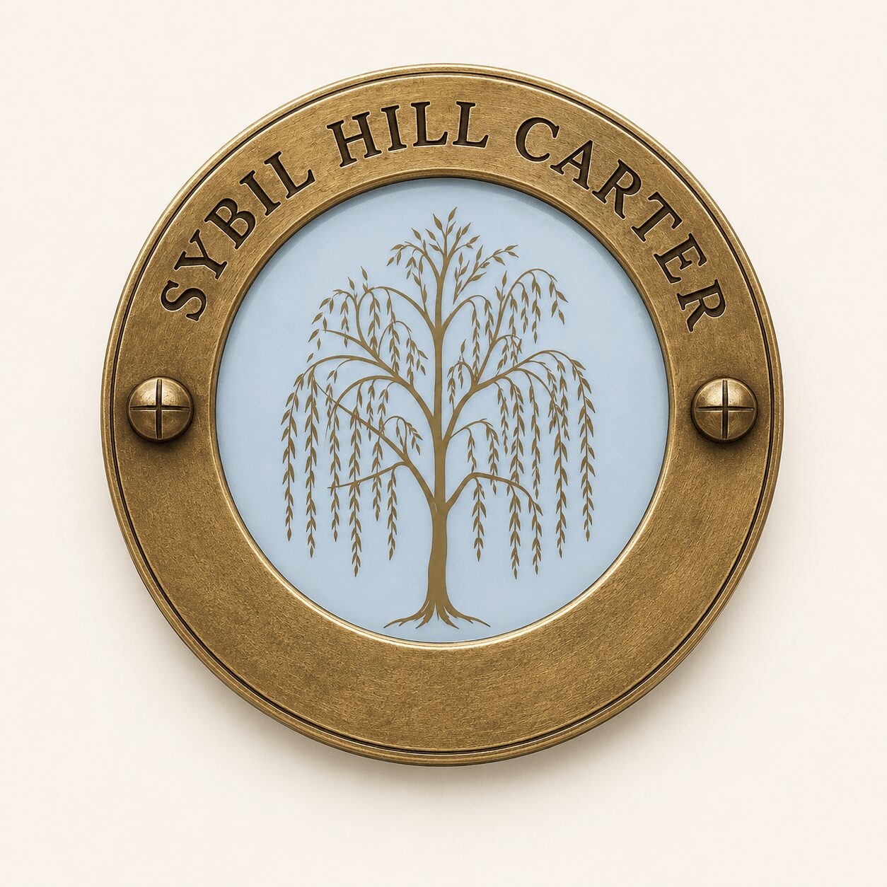 Round brass plaque with 'SYBIL HILL CARTER' and a tree illustration in the center.