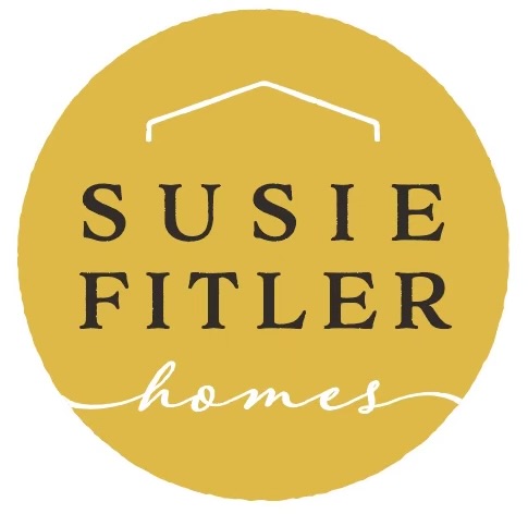Yellow circular logo with black text reading 'Susie Fitler homes' and a simple house outline above.