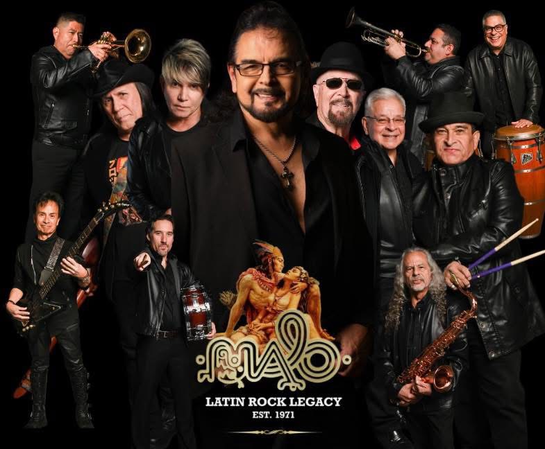 Group of musicians with instruments, central man holding a lion statue, black background, Latin Rock Legacy logo, 1971.