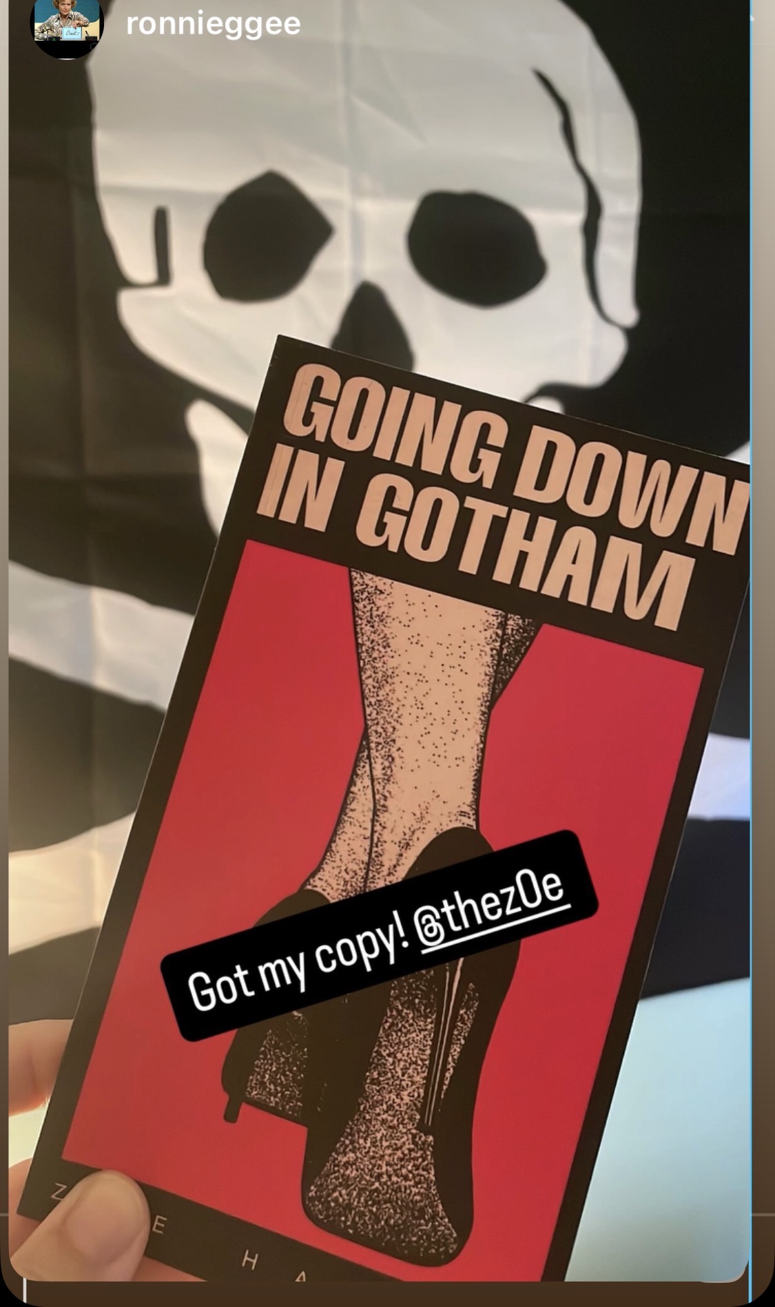 A phone screen displays a person wearing fishnet stockings and high heels, with a text overlay about Gotham and a social media handle.
