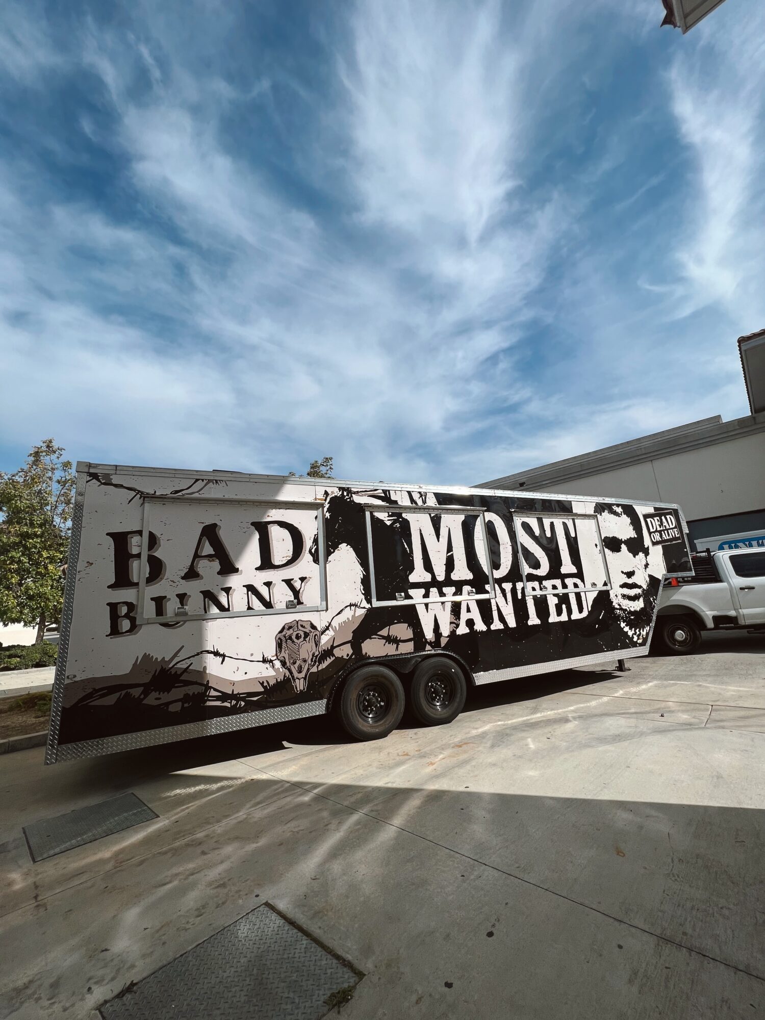 A truck with a black and white mural of a bunny and the words 