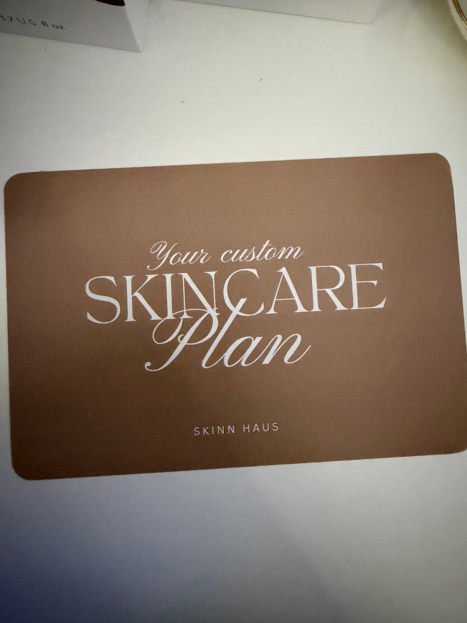 Brown card with white text reading 'Your collection of SKY GARE' and smaller text 'SEIN HAUS'.
