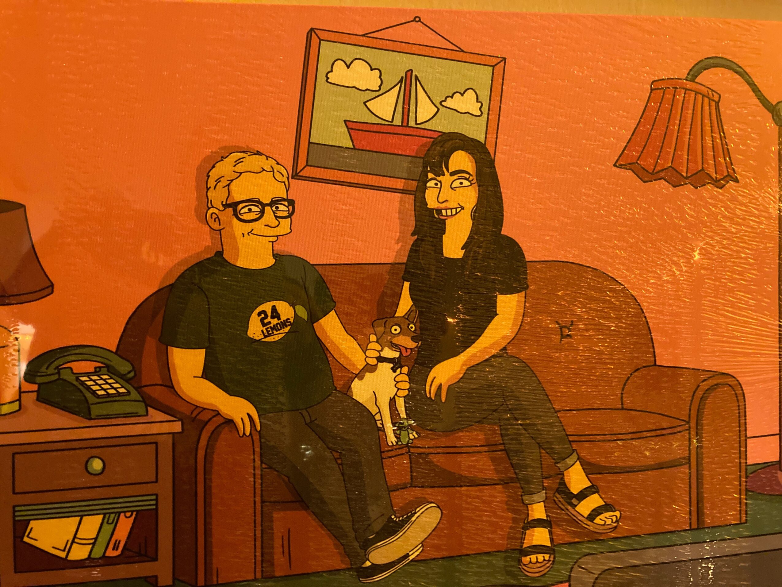 Two animated characters sitting on a sofa in a room with a framed picture of a boat and a lamp, holding a small dog.