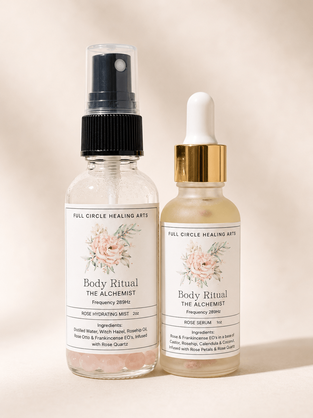 Two small glass bottles with white labels and floral designs, one with a spray nozzle and the other with a dropper cap.