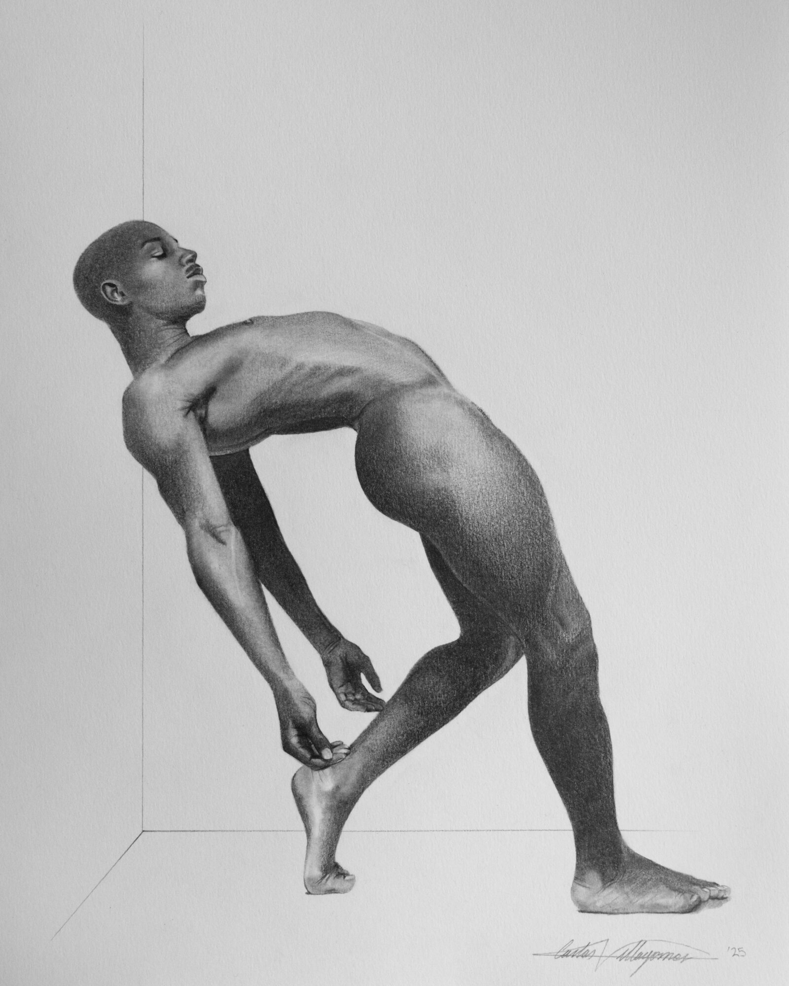 Black and white photo of a person with a muscular build, leaning back with one foot on the ground and the other raised, in a corner.