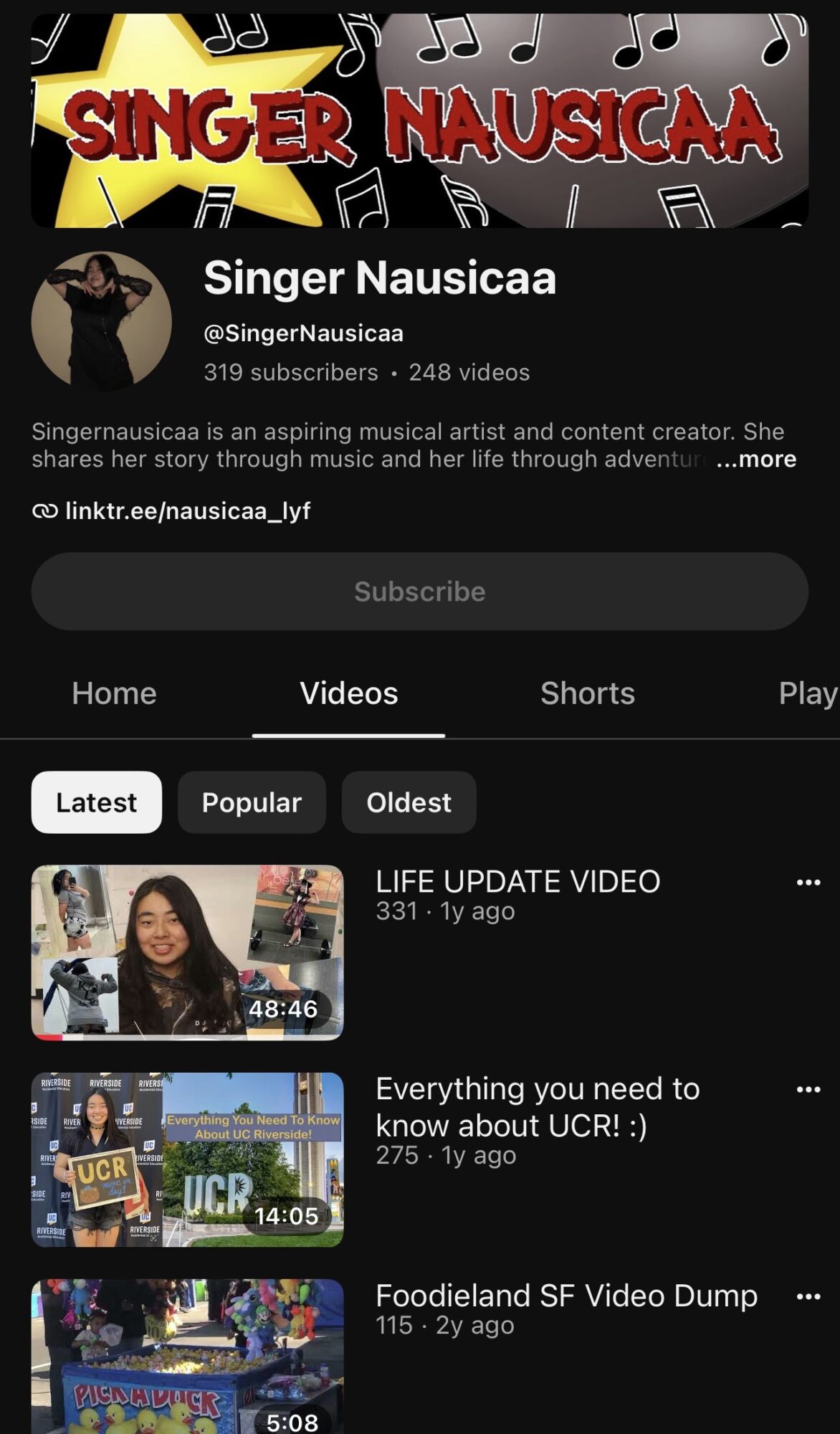 YouTube channel page for Singer Nausicaa with channel art, profile picture, and video thumbnails.